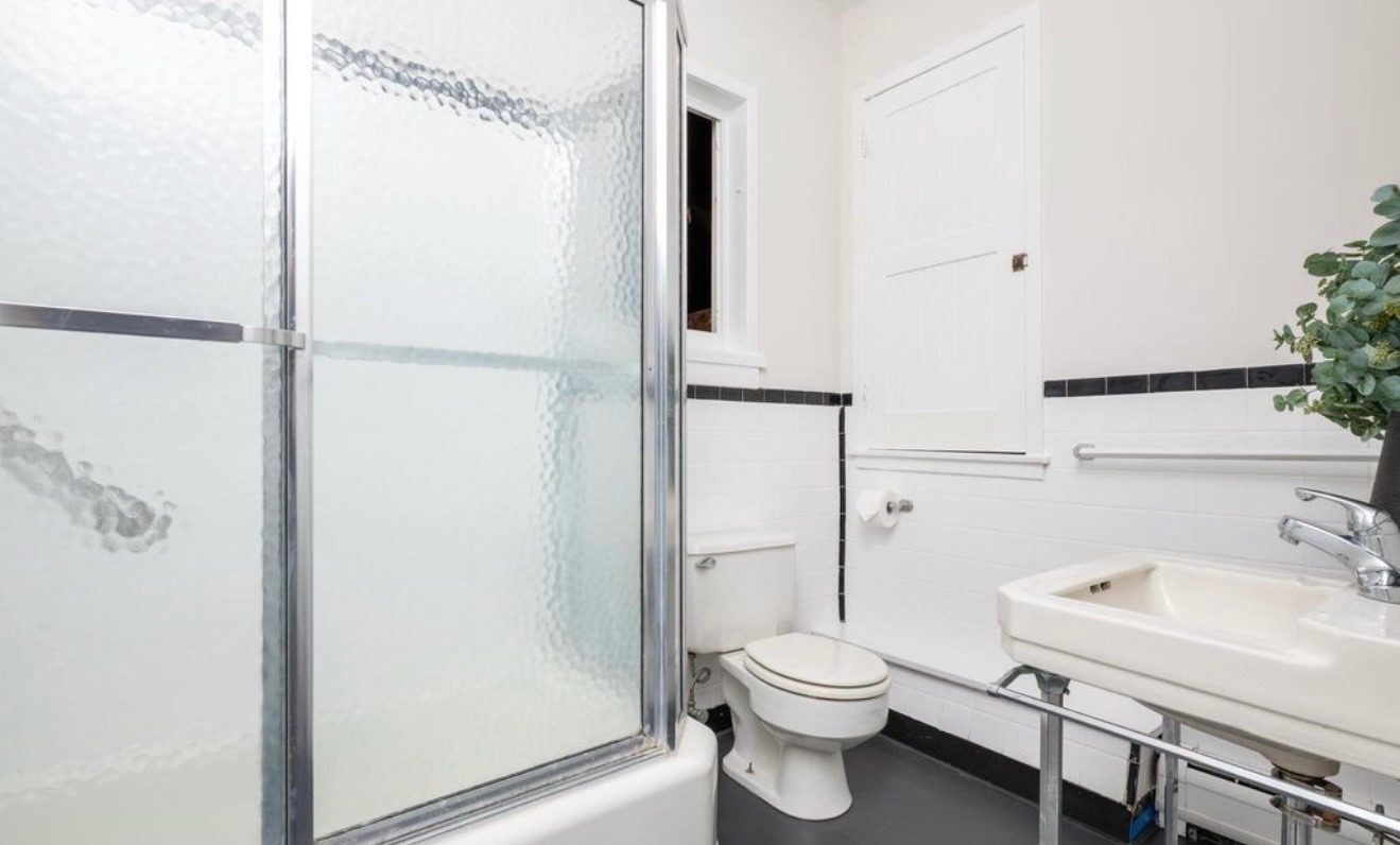 Bathroom after renovation with white subway tile